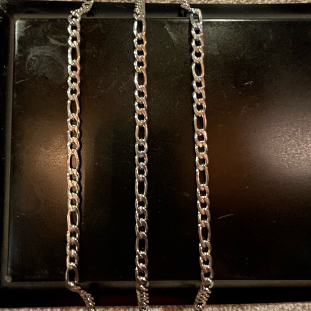 Three silver M chains. All are 18”
